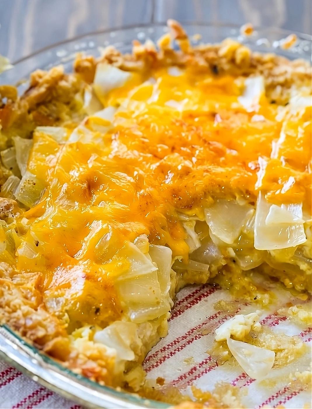 Vidalia Onion Pie in a pie plate with slice cut away.