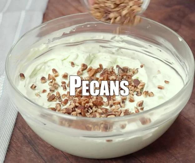 Adding pecans.