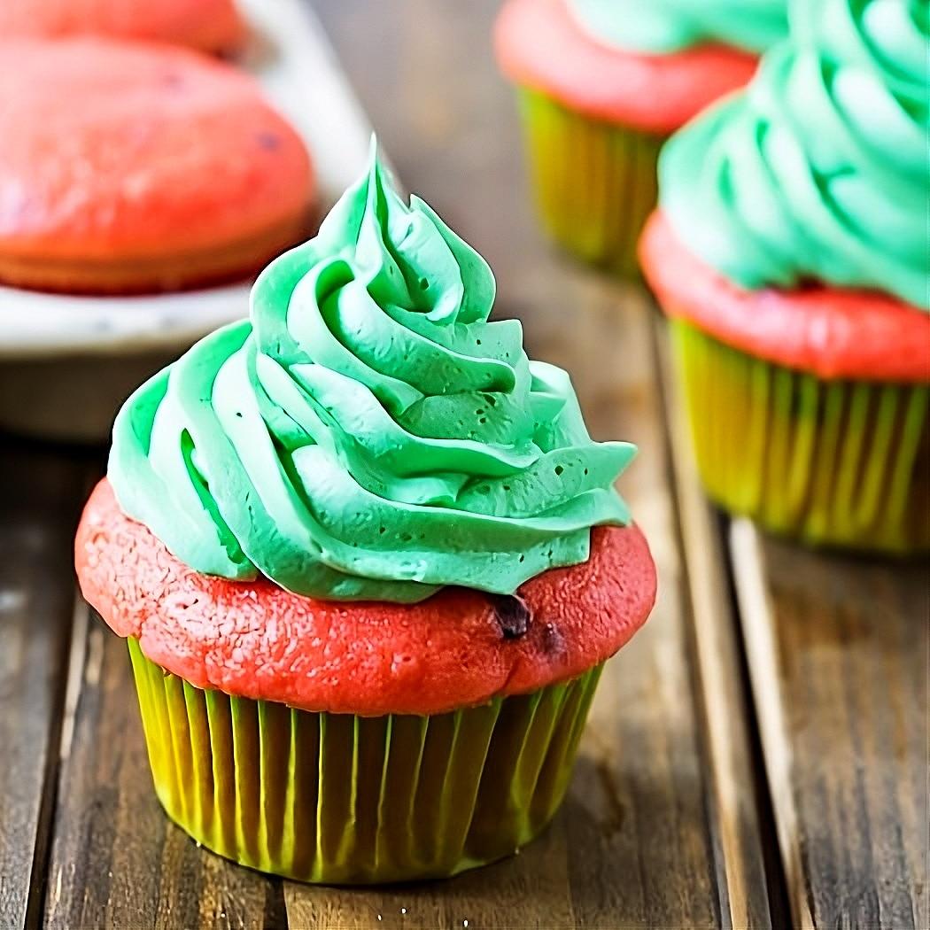 Watermelon Mojito cupcakes on a picnic table.
