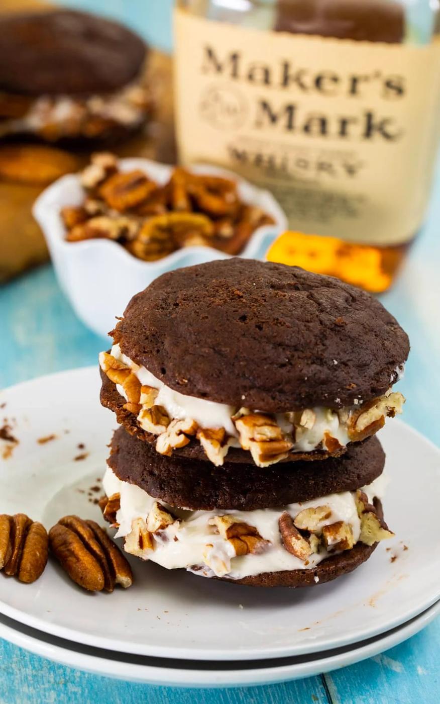 Two cream filled cookies stacked on top of each other.