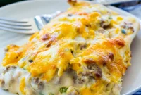 Hearty Southern Breakfast Enchiladas Smothered in Sausage Gravy