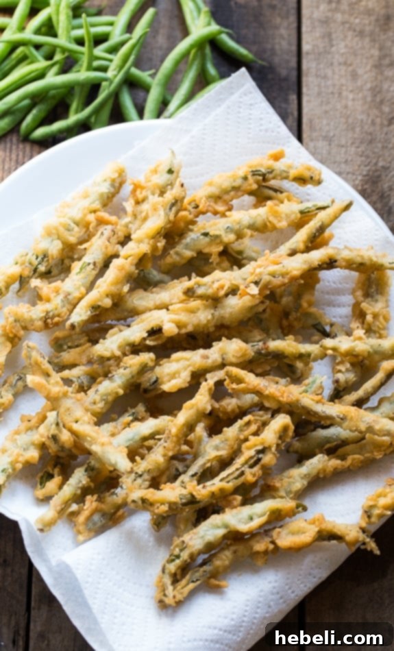 Crunchy Green Bean Fries 3 Close-up of crispy fried green beans showcasing their flavorful, golden batter.