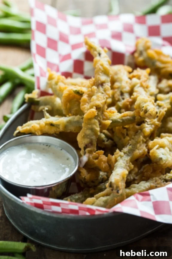 Multiple images displaying crispy fried green beans, perfectly double-coated in a delicious batter.