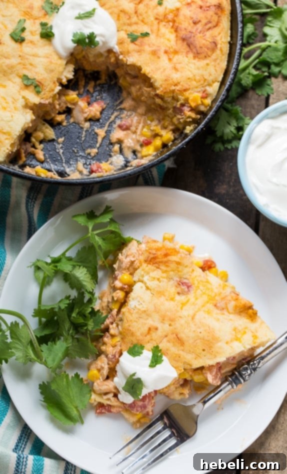 A close-up view of the creamy Mexican Cornbread Chicken Casserole before baking.