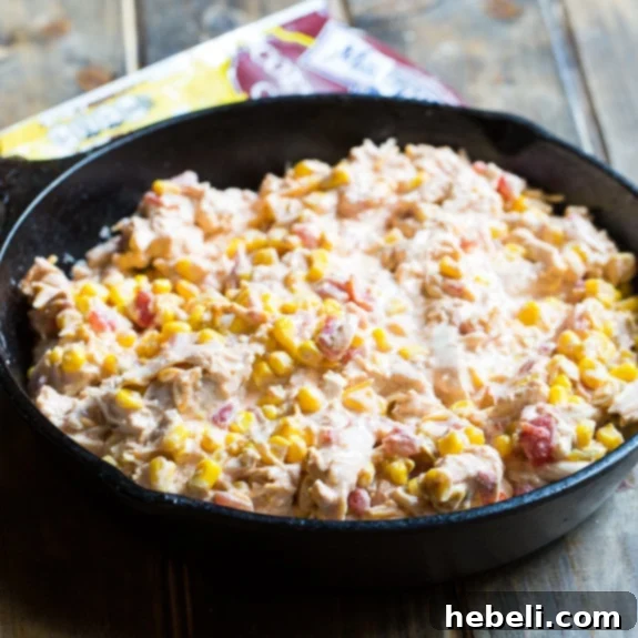 The Mexican Chicken Cornbread Casserole bubbling hot out of the oven, with a perfectly golden cornbread crust.