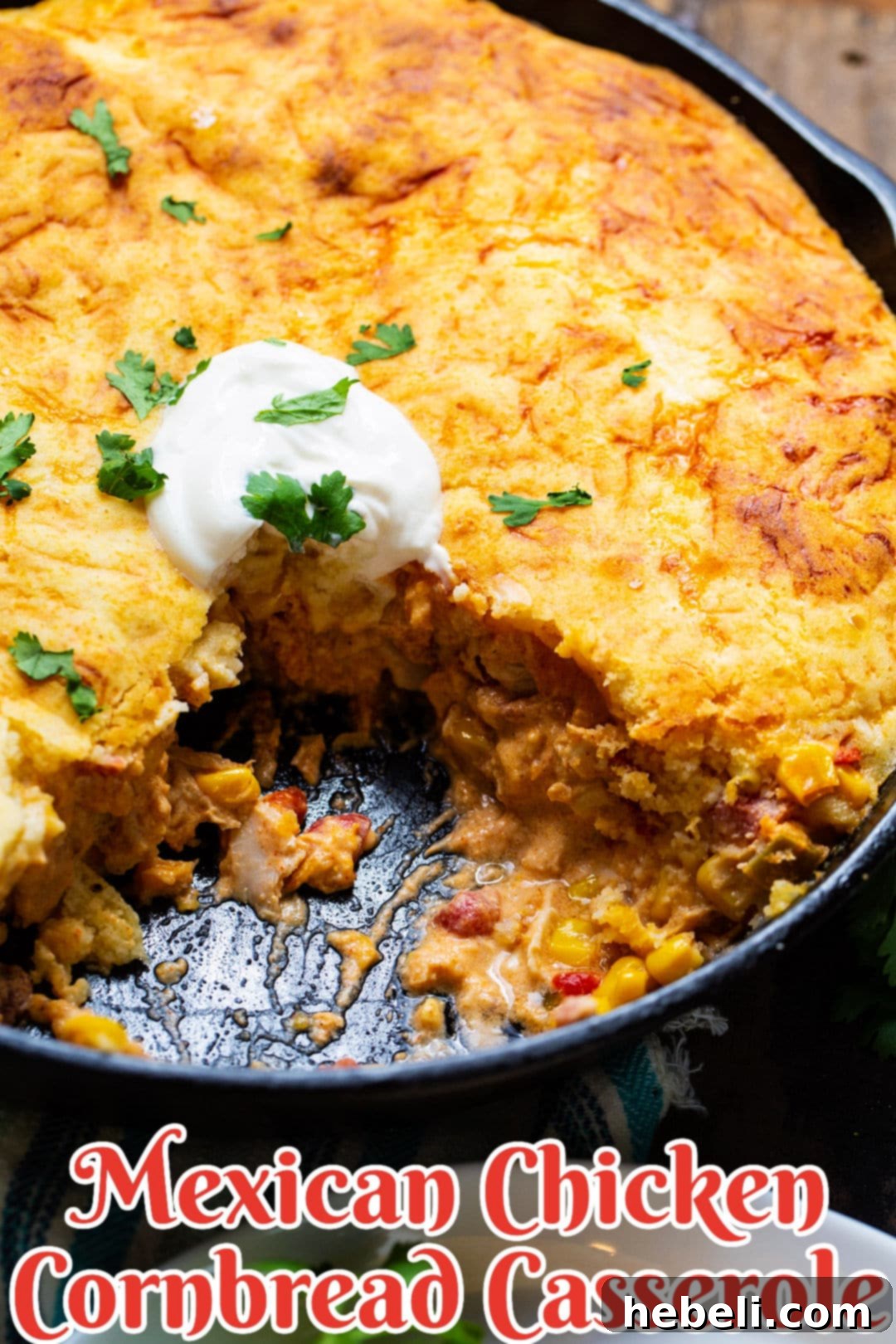 The full Mexican Cornbread Casserole in a cast iron skillet, golden brown and perfectly baked.