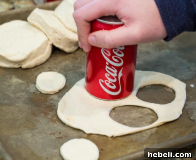 Cutting biscuit dough circles with a can for fritters