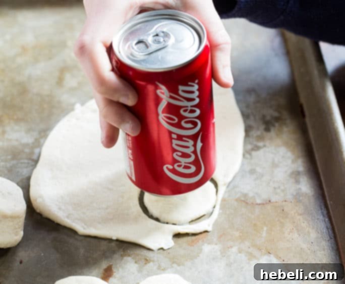 Biscuit dough circles neatly arranged, ready for filling