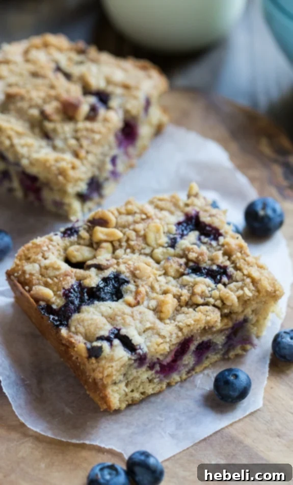 Guilt-Free Blueberry Coffee Cake 3 Close-up of Lightened-Up Blueberry Coffee Cake slices, highlighting the juicy blueberry pockets and crunchy streusel topping