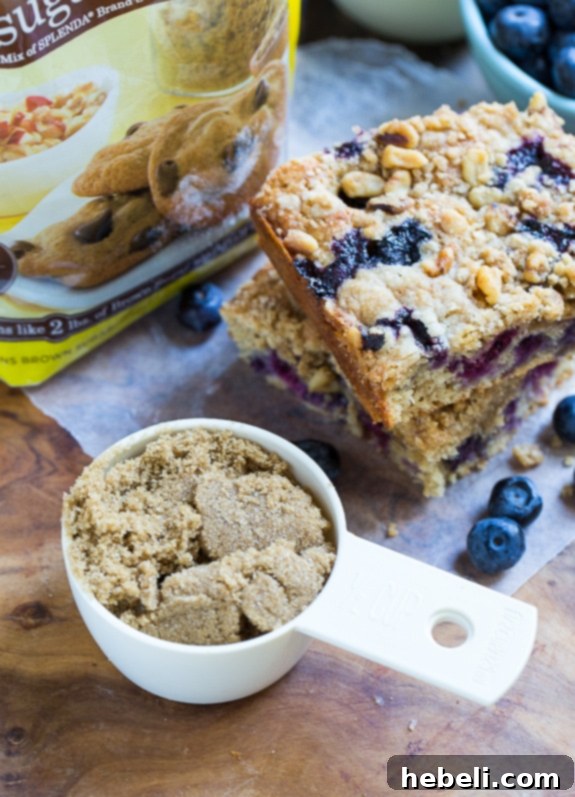 Guilt-Free Blueberry Coffee Cake 5 SPLENDA® Brown Sugar Blend package displayed alongside a bowl of fresh ingredients for Lightened-Up Blueberry Coffee Cake