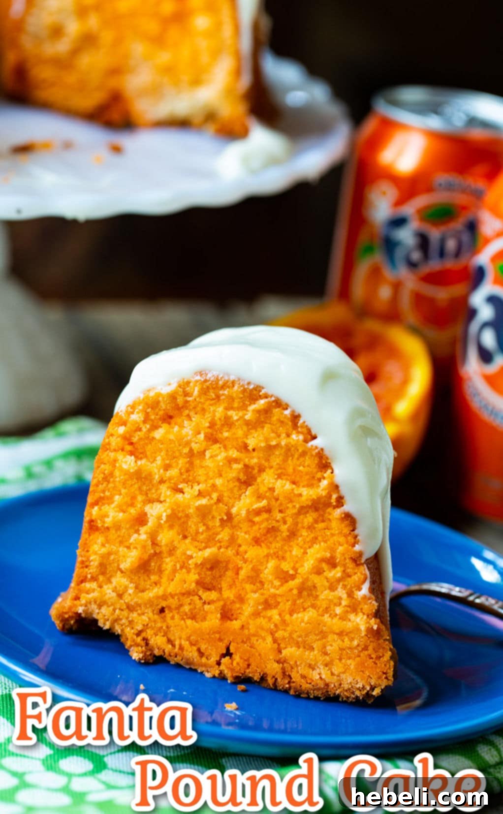Close-up slice of Fanta Pound Cake on a blue plate.