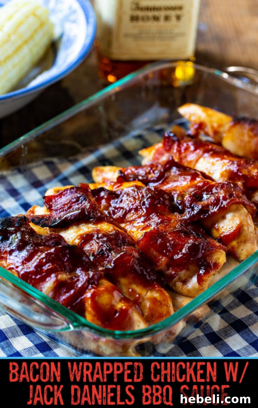 Jack Daniels Glazed Bacon Chicken 4 Close-up of perfectly cooked Bacon Wrapped Chicken with Jack Daniels BBQ Sauce in a 9x13-inch baking dish, showcasing its golden-brown, crispy exterior and rich glaze.