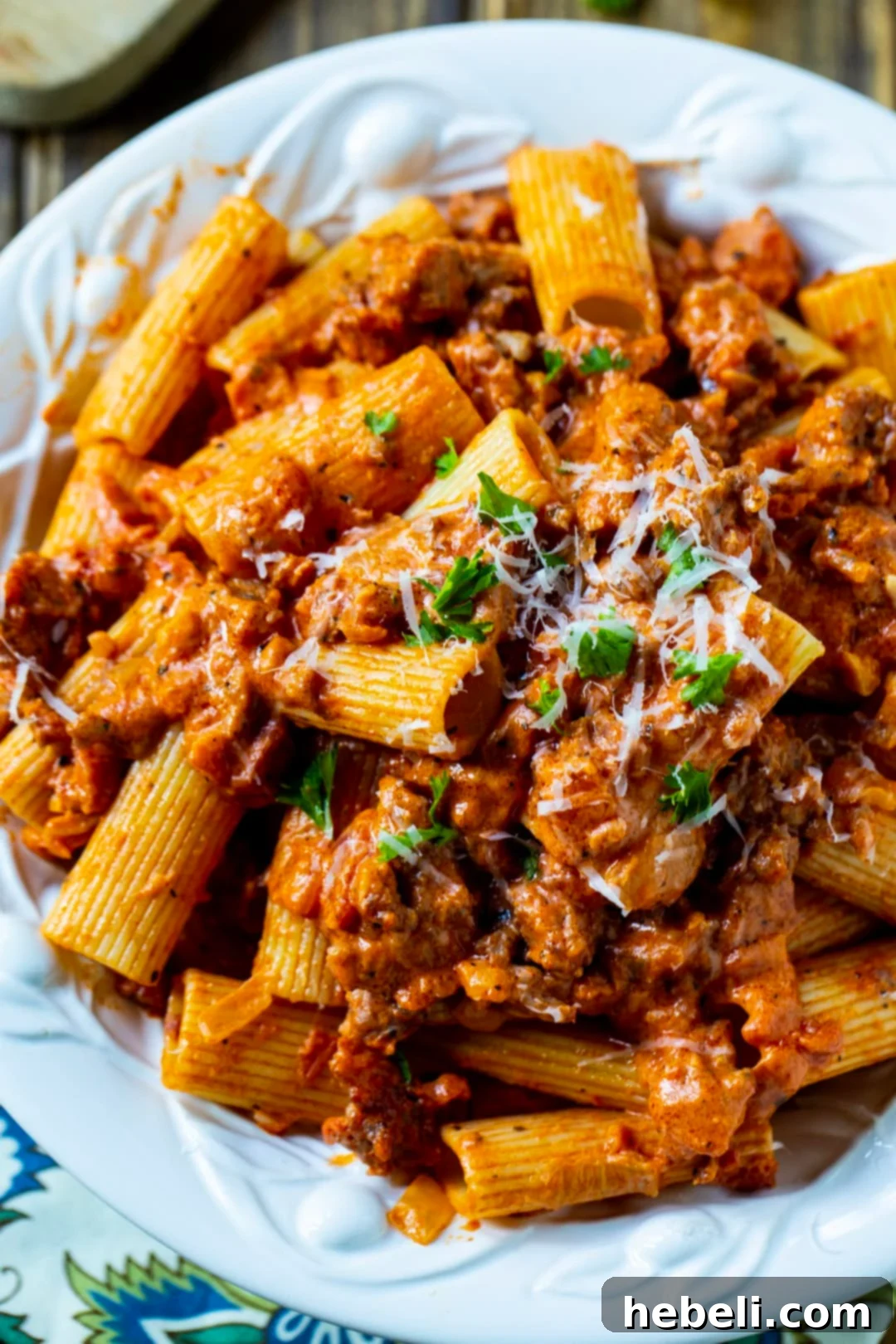 A close-up shot of the Italian Sausage Rigatoni, showing the rich sauce and perfectly cooked pasta.