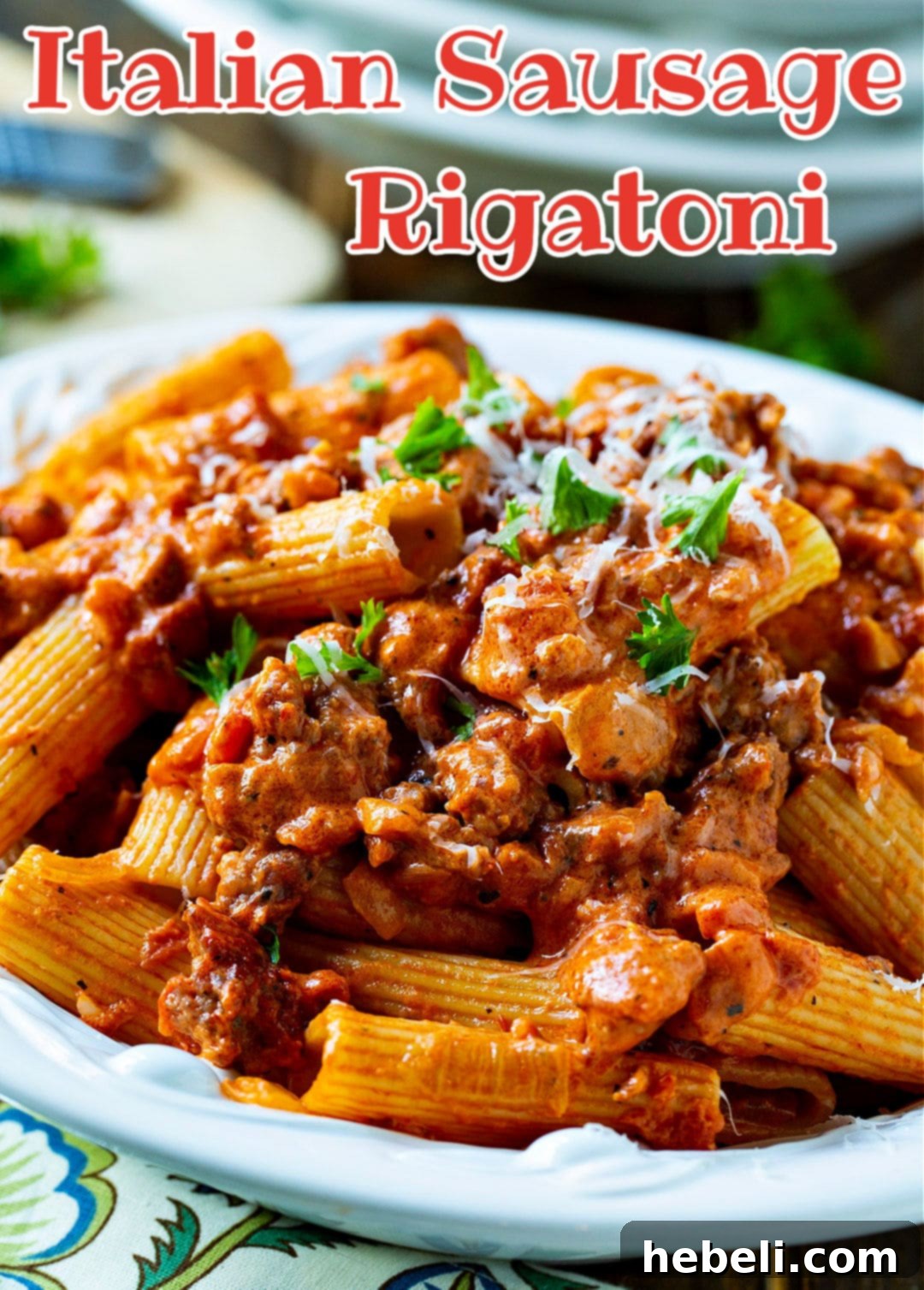 A large serving bowl filled with Italian Sausage Rigatoni with Spicy Cream Sauce, ready to be enjoyed.
