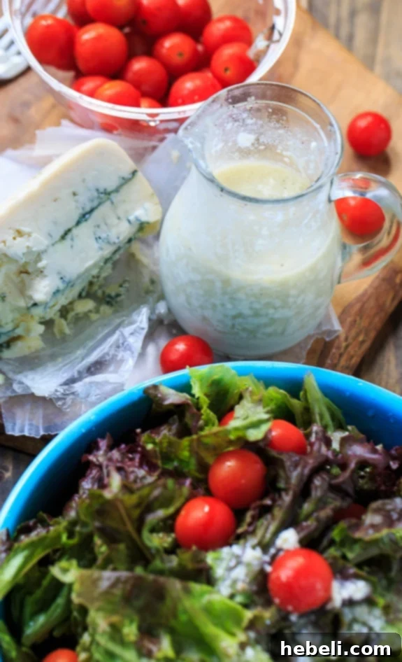 Blue Cheese Vinaigrette in a serving bowl with a spoon, ready for use