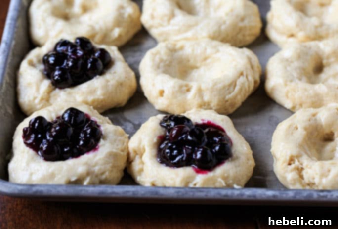 Bursting Blueberry Kolaches 3 Overnight-risen kolache dough in a bowl, ready for shaping.