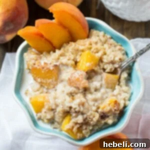 Creamy Slow Cooker Peach Oatmeal 6 Crock Pot Peaches and Cream Oatmeal in a serving bowl, garnished with fresh peaches.