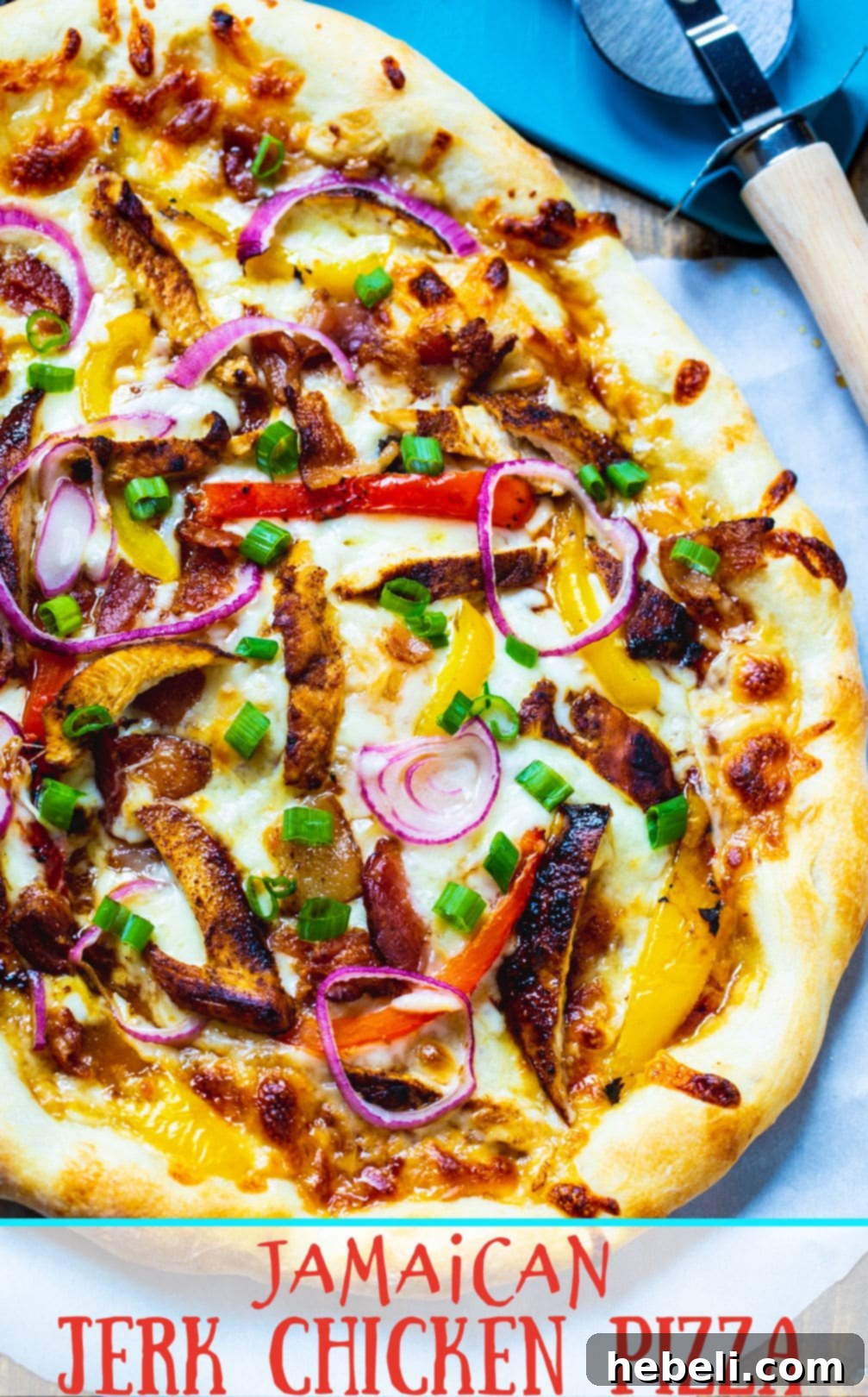 Whole Jamaican Jerk Chicken Pizza with all toppings visible, ready to be sliced