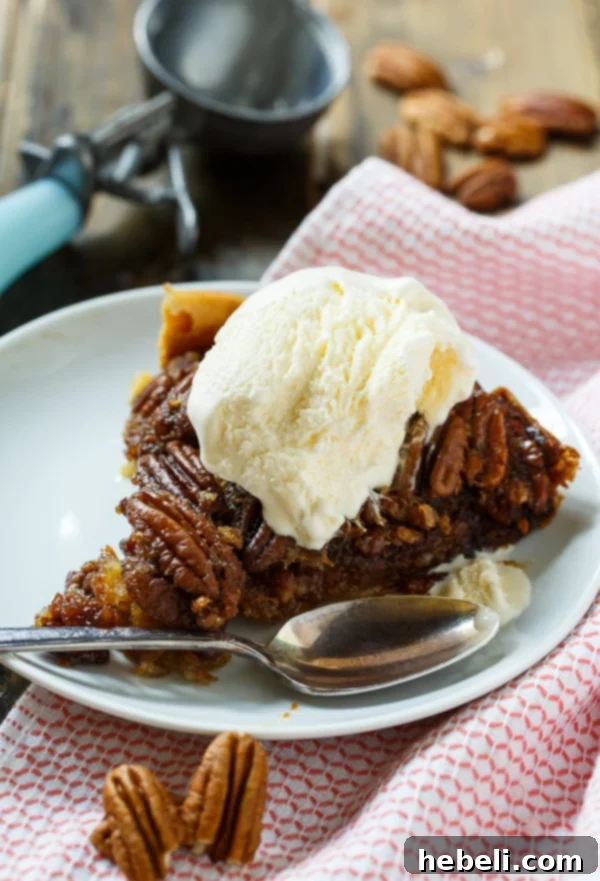 Close-up of the delicious Crock Pot Pecan Pie showing the deep, caramelized filling and perfectly toasted pecans.