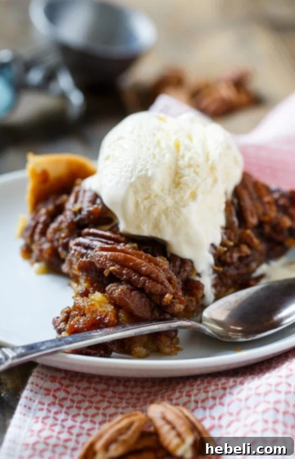 The full Crock Pot Pecan Pie, glistening with its sweet filling and a generous layer of toasted pecans on top, ready for slicing.
