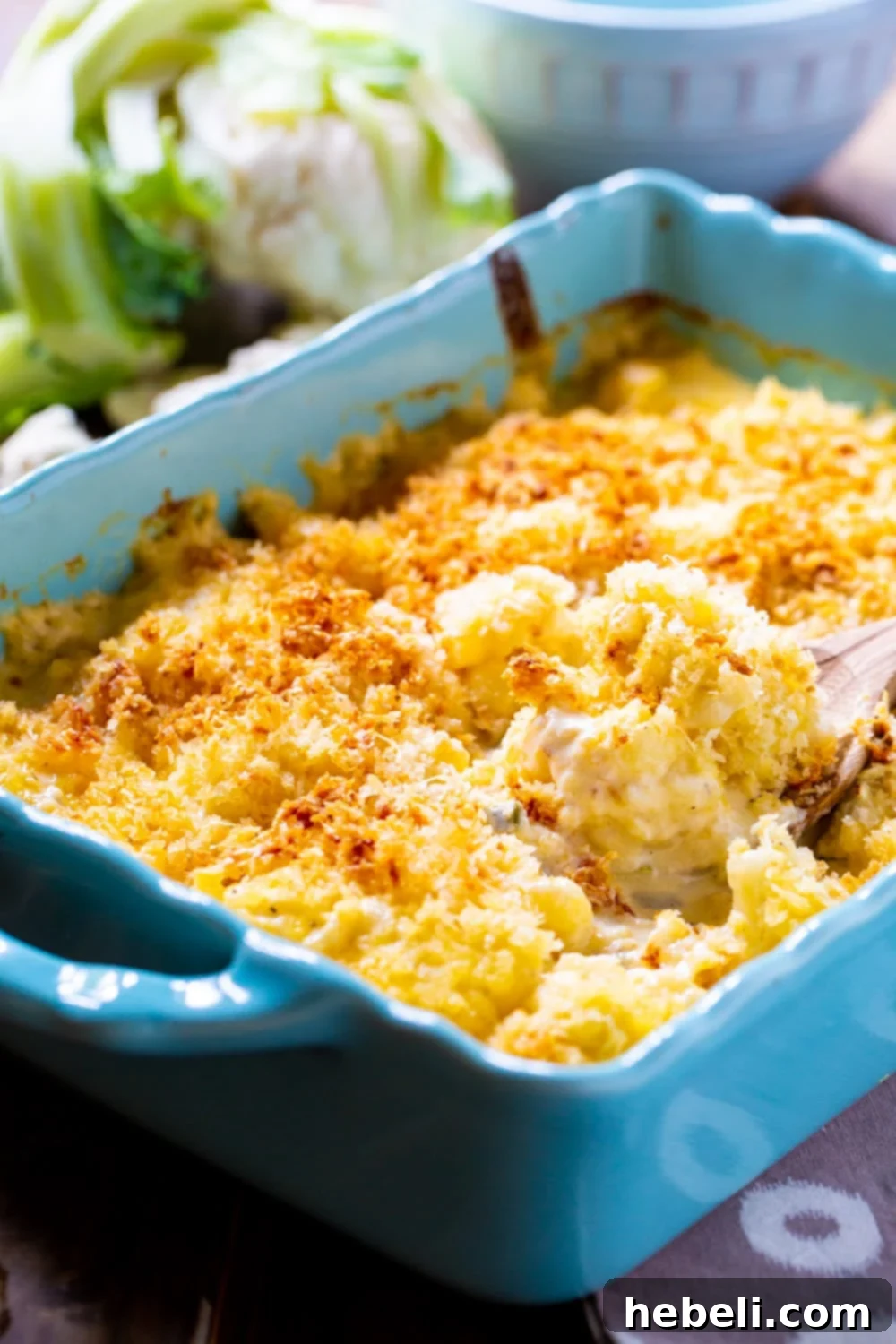 Velvety Cauliflower Mash 3 Close-up shot of Creamed Cauliflower in a blue baking dish, showing its rich, creamy texture and golden topping.