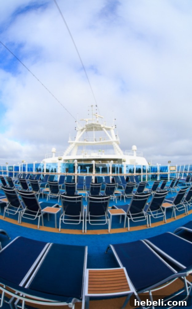 Ruby Princess pool deck with people relaxing
