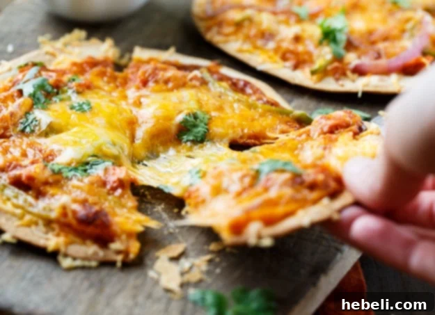 Delicious BBQ Salmon Tortilla Pizzas, freshly baked and garnished with fresh cilantro