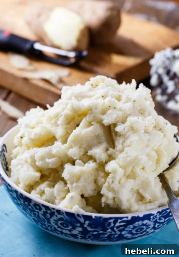 A bowl of creamy mashed potatoes prepared with Duke's Mayonnaise, showcasing a perfect fluffy texture.