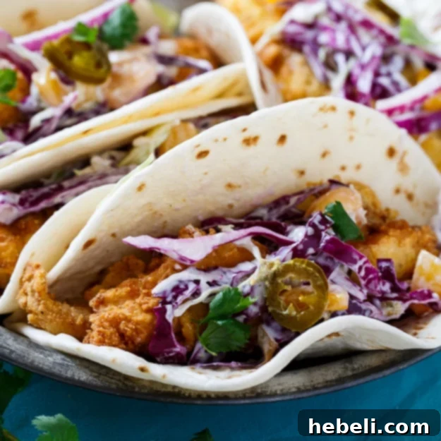 Southern Catfish Tacos with Jalapeno Peach Slaw, a delightful fusion dish inspired by Mexican travels.