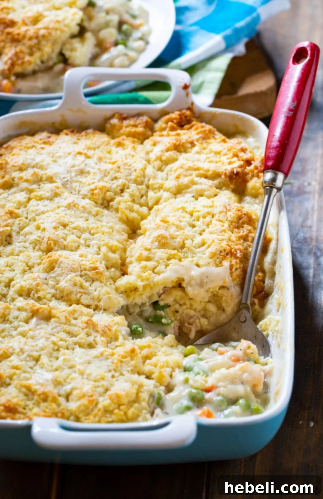 Close-up of baked Chicken Pot Pie with Biscuit Topping in a baking dish, showing the golden-brown biscuit crust.