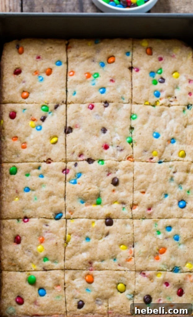 A whole pan of M&M Blondies, freshly baked and ready to be cut