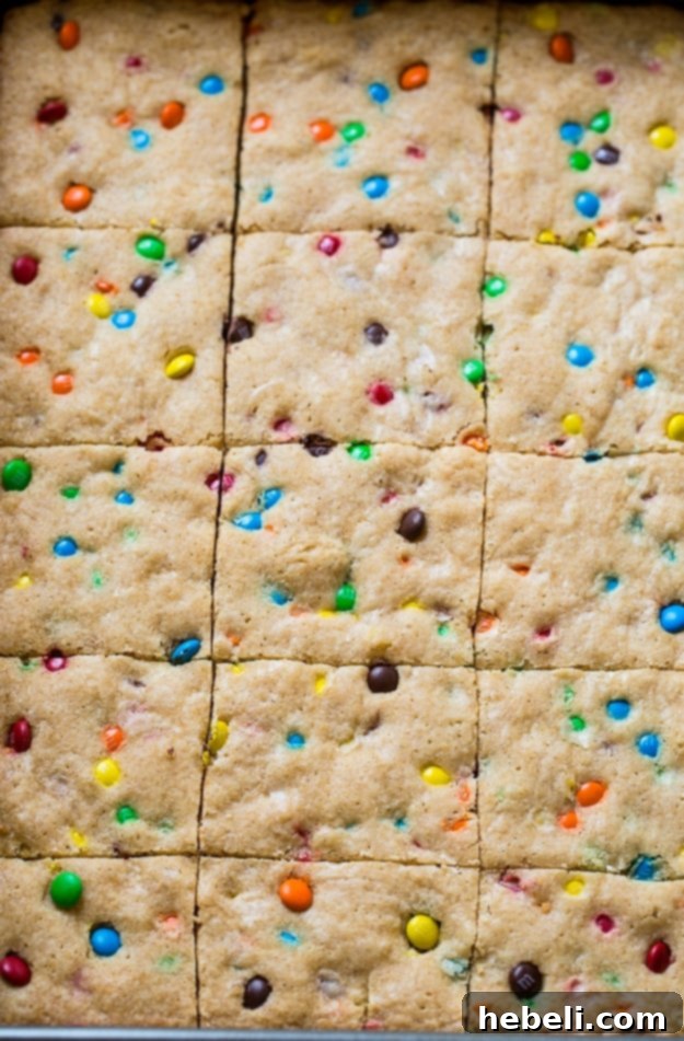 Stacked M&M Blondies showcasing their vibrant M&M toppings