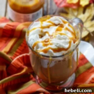 Salted Caramel Latte, beautifully presented in a mug with whipped cream and caramel drizzle.