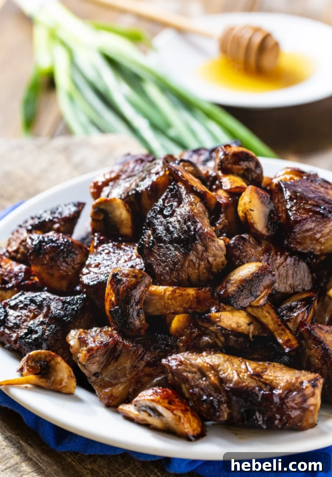 Steak Bites with Mushrooms on a plate, ready to be enjoyed.