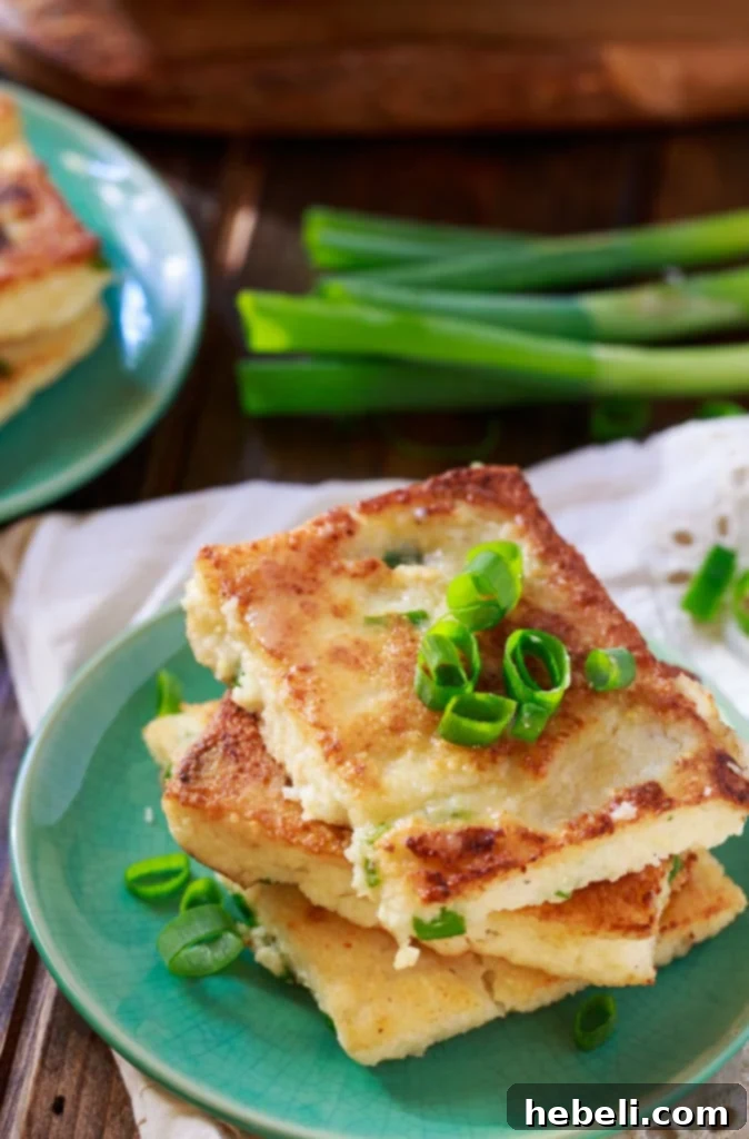 Creamy Mascarpone Grit Cakes 3 Close-up of golden Mascarpone Grit Cakes on a serving dish, highlighting their crispy texture
