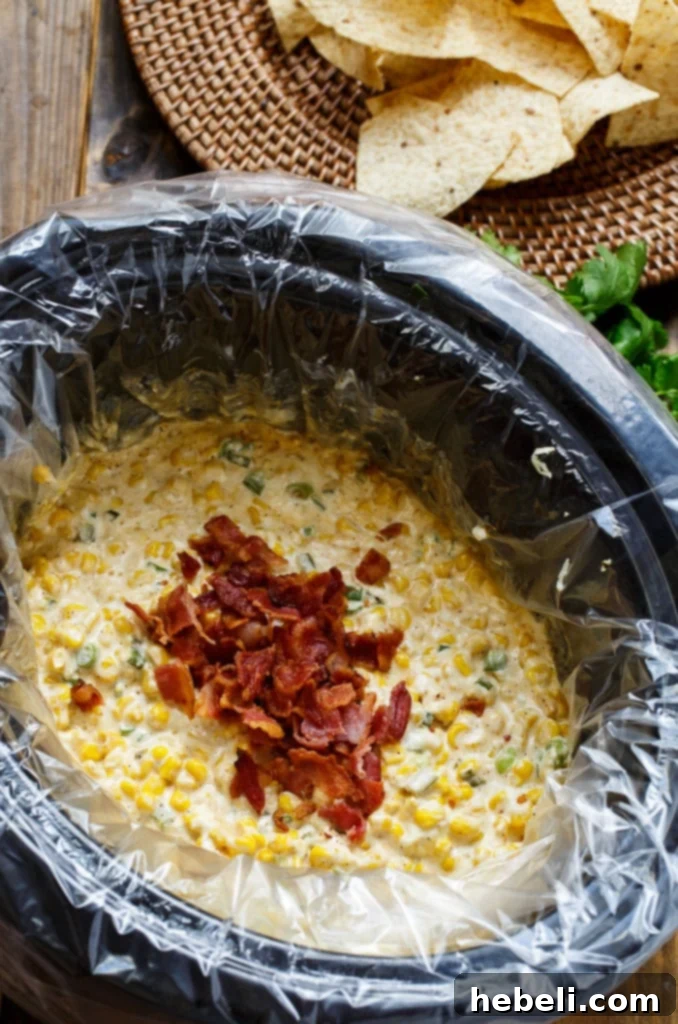 Cheesy Slow Cooker Corn Dip 3 Slow Cooker Corn Salsa with easy clean-up thanks to Reynolds Slow Cooker Liners. Dump everything in the crock pot and 2 hours later you have a warm and creamy dip.
