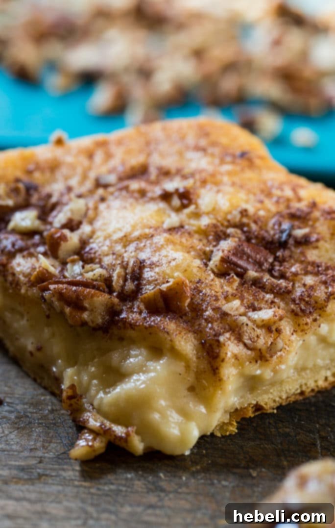 A whole Easy Cream Cheese Danish with creamy filling, ready to be sliced.