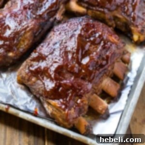 Close-up of perfectly cooked slow cooker ribs with a caramelized BBQ glaze