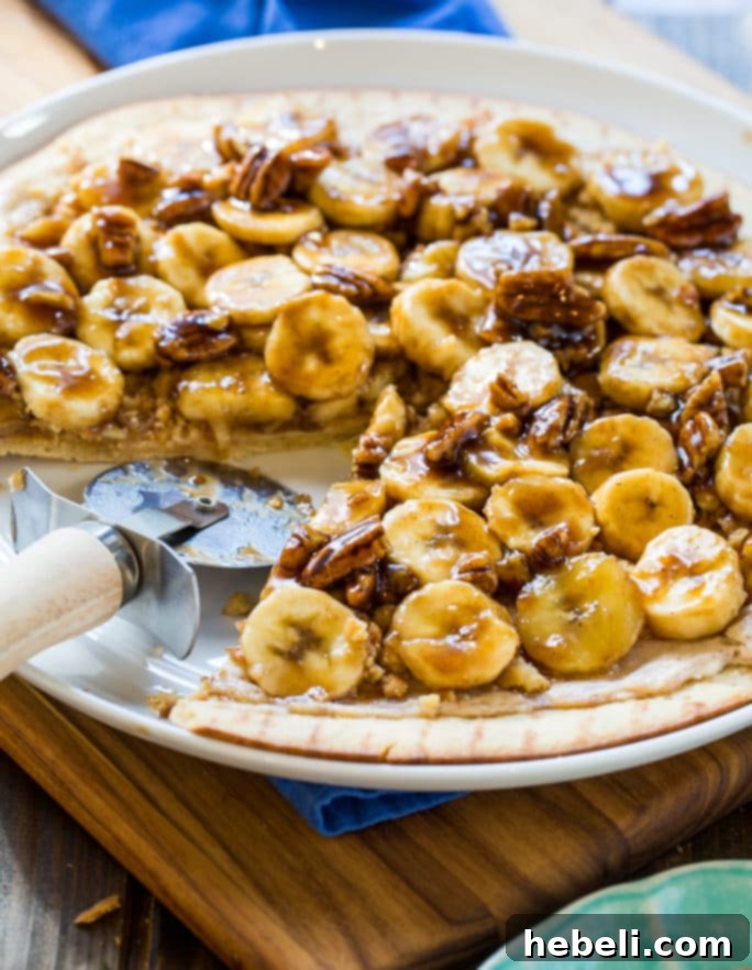 Bananas Foster Dessert Pizza served with a scoop of vanilla ice cream