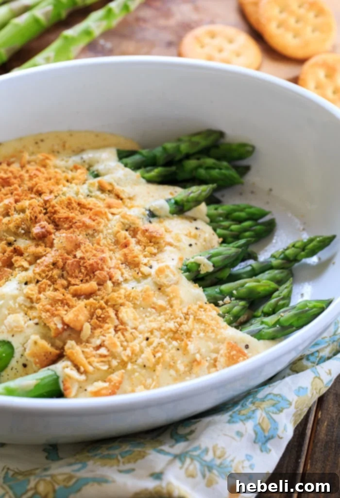 Asparagus Mornay - tender asparagus stalks covered in a cheesy sauce and crushed Ritz crackers. Perfect for Easter brunch.