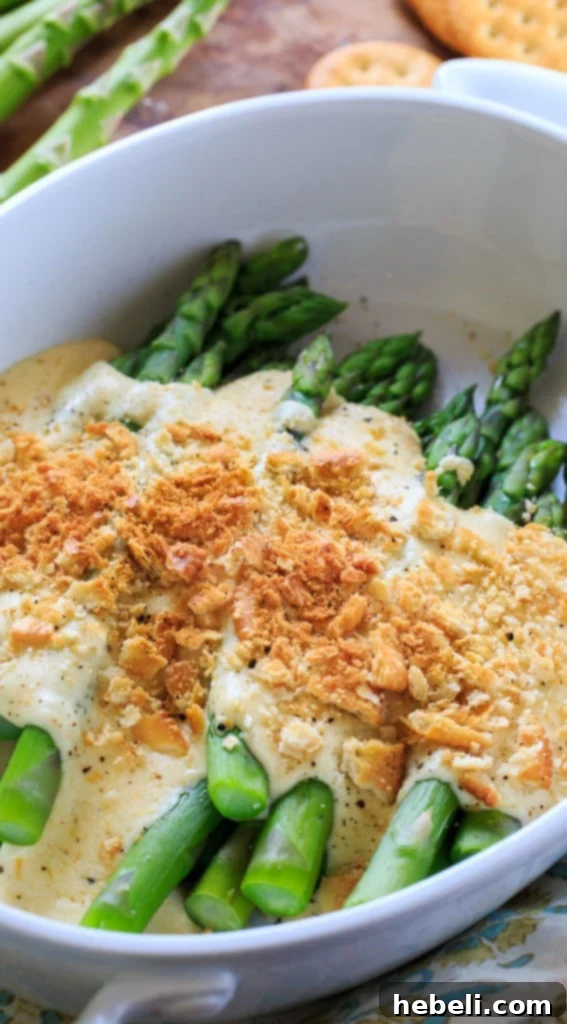 Asparagus Mornay - tender asparagus stalks covered in a cheesy sauce and crushed Ritz crackers. Perfect for Easter brunch.