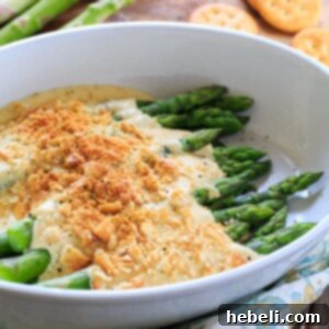 Asparagus Mornay - tender asparagus stalks covered in a cheesy sauce and crushed Ritz crackers. Perfect for Easter brunch.