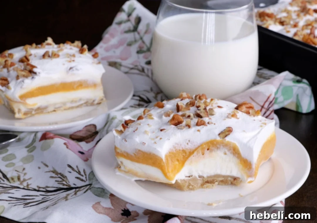 A delightful piece of Butterscotch Lush with a bite taken, revealing its soft, creamy interior.