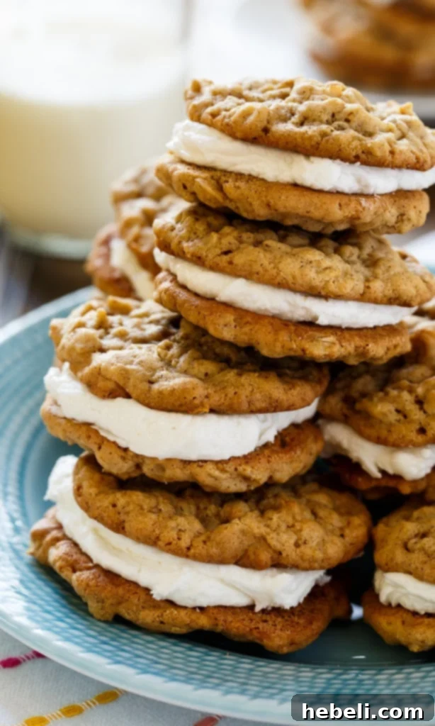 Chewy Oatmeal Sandwich Cookies 4 A tray of freshly baked oatmeal cookie halves cooling on a wire rack, perfectly golden and waiting for their creamy marshmallow center.