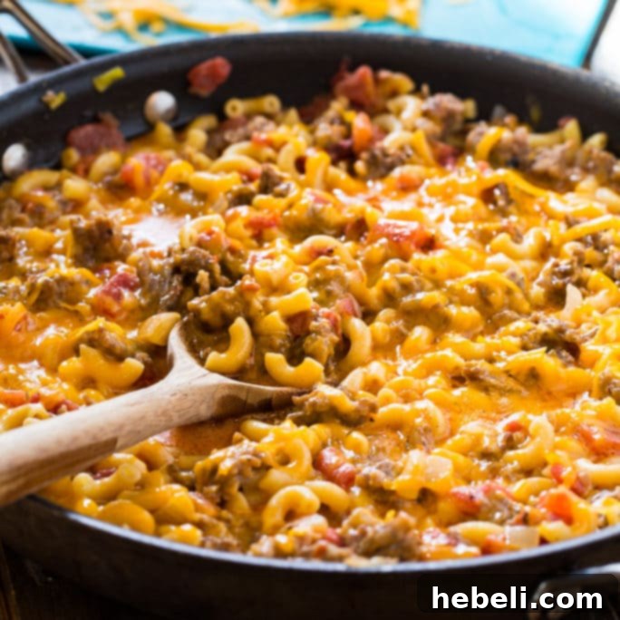 Final plated serving of Stovetop Sausage Mac and Cheese, garnished and ready to enjoy.