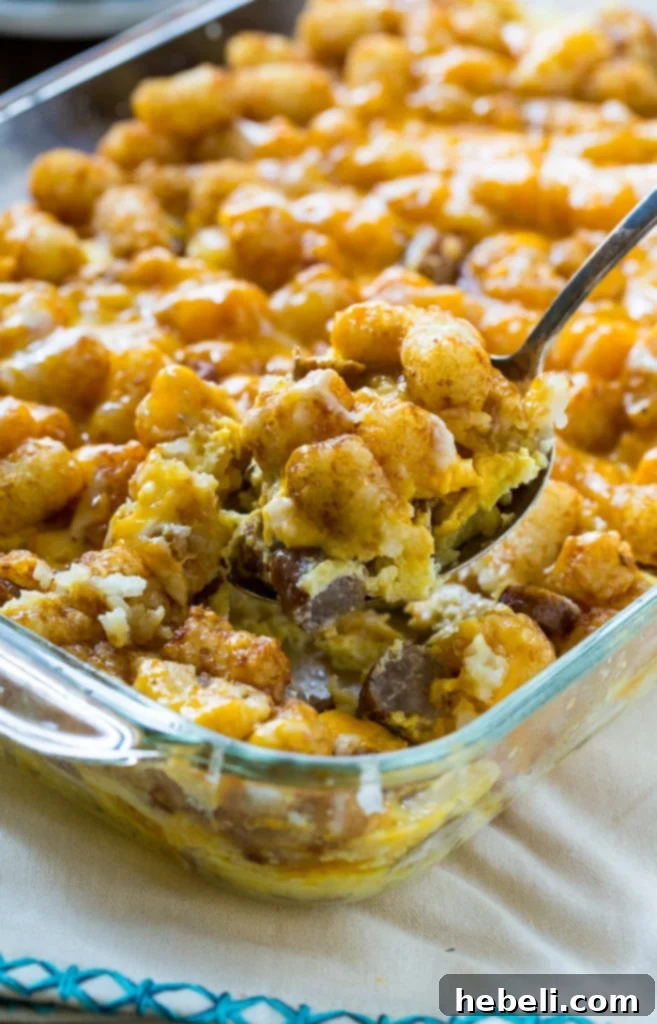 Large Breakfast Tater Tot Casserole ready to be served, showcasing its golden crust and delicious filling.