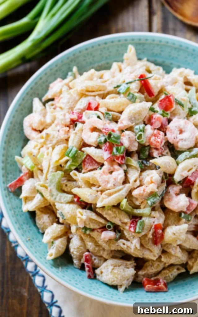 A vibrant bowl of Shrimp Remoulade Pasta Salad, showcasing the colorful ingredients