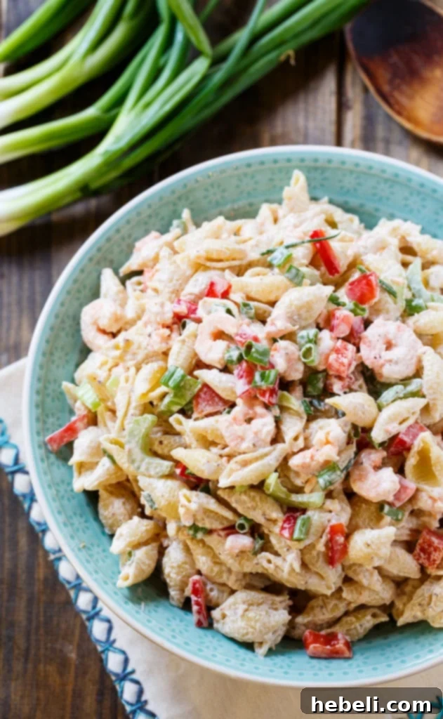 Ingredients for Shrimp Remoulade Pasta Salad, including perfectly cooked pasta and fresh vegetables