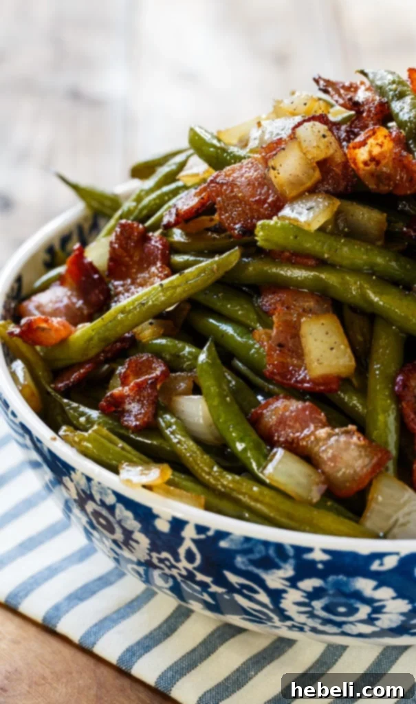 Prepared fresh green beans, trimmed and ready for cooking, alongside the other ingredients.