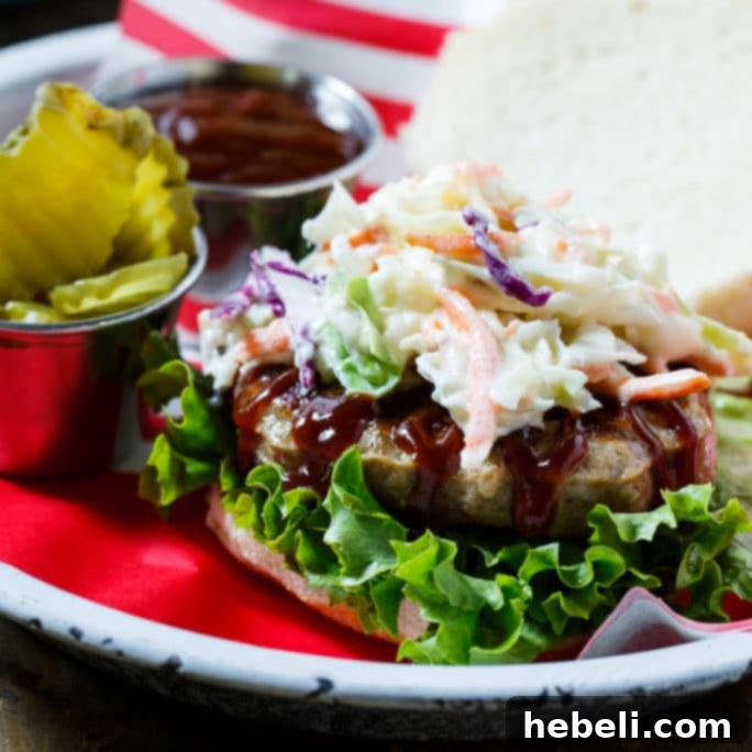 Southern BBQ Pork Burgers with creamy coleslaw and BBQ sauce.